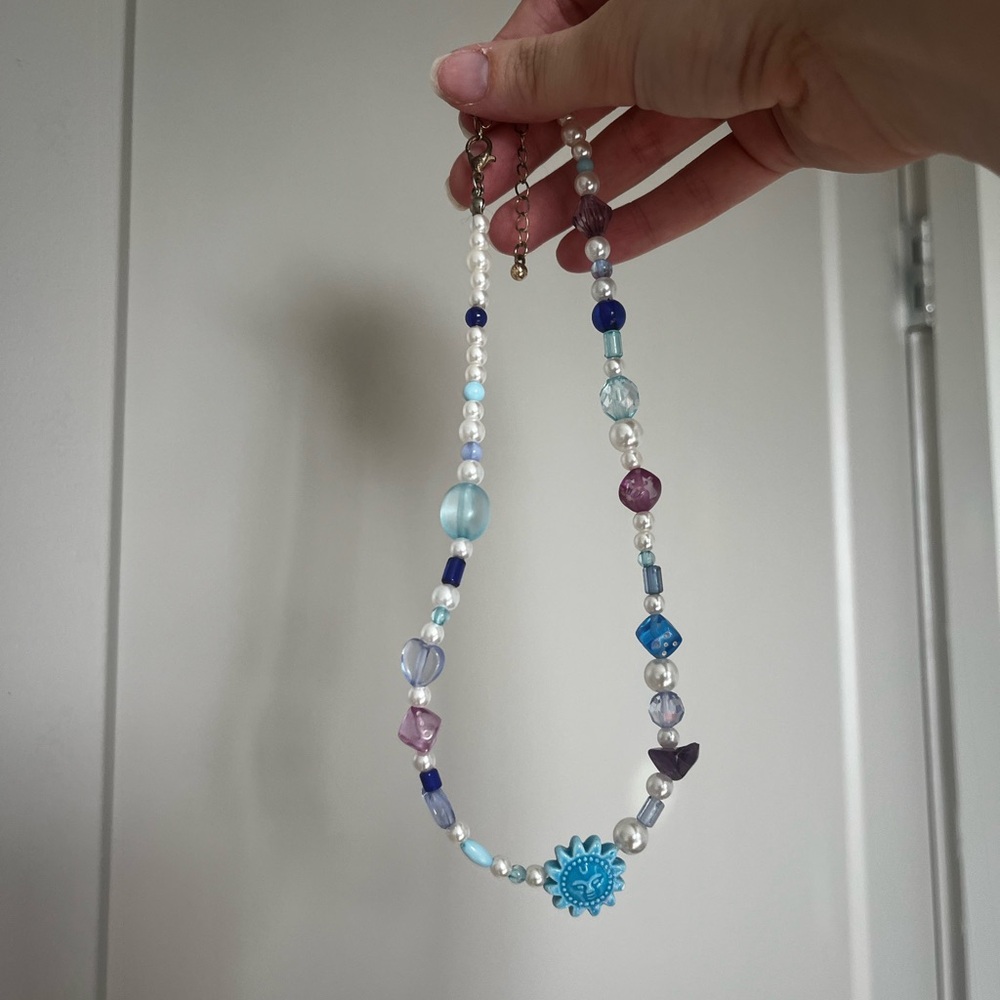 Urban Outfitters Blue Charm Necklace with clasp.
